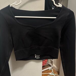 Black OQQ cropped workout top, size M